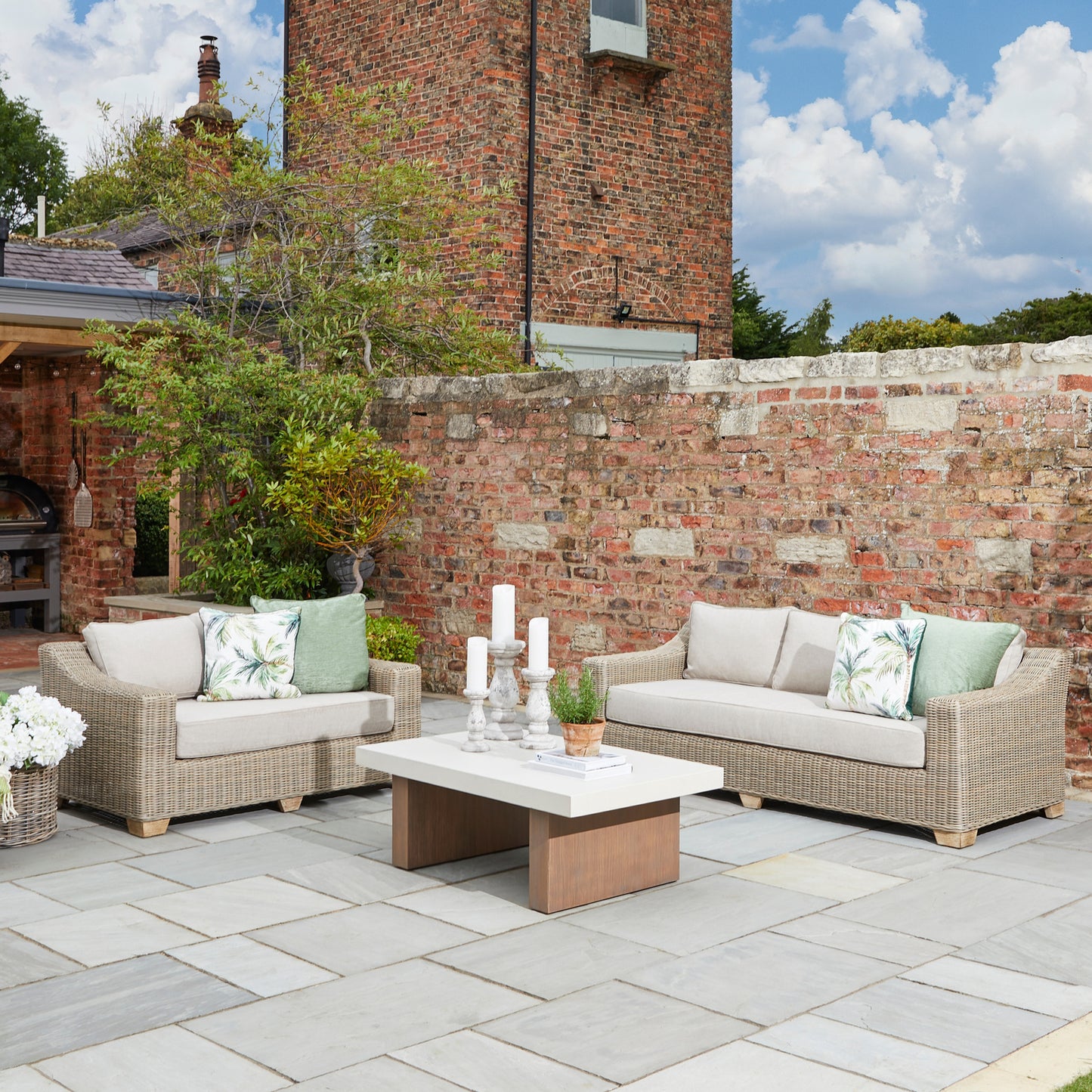 Hill Interiors Capri outdoor sofa showing the seat cushion thickness and overall proportions