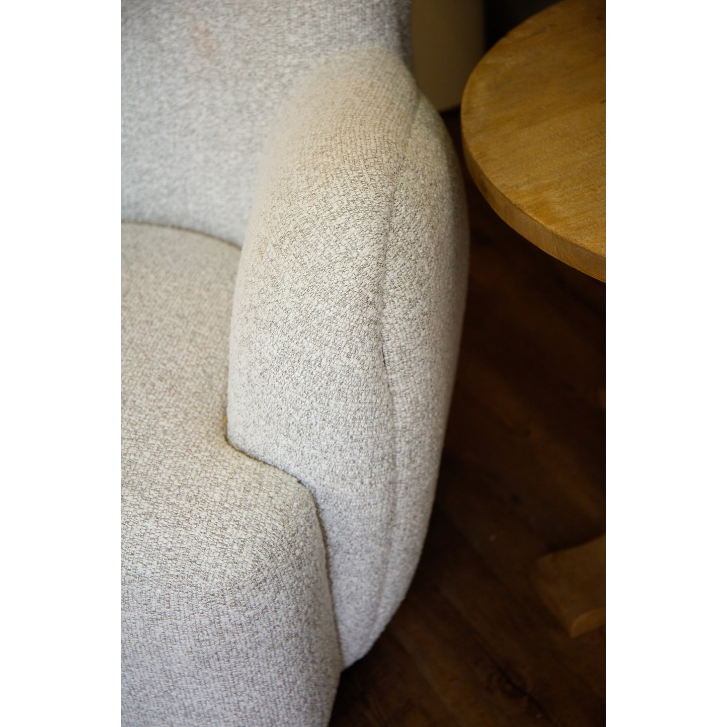Hill Interiors Greige Hui large armchair styled with cushions and throws