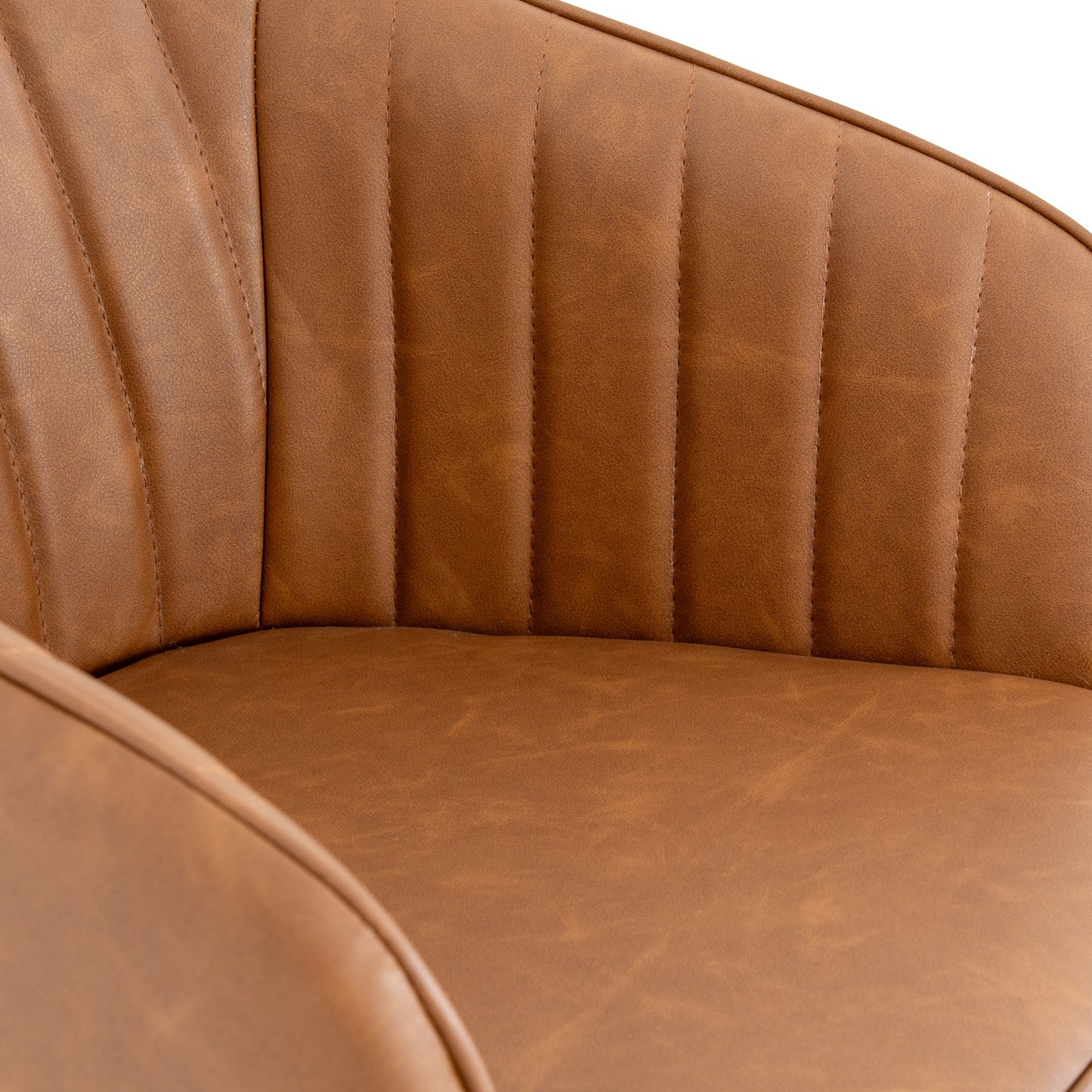 Hill Interiors Uppsala tan dining chair in a modern dining room with wooden table and natural lighting