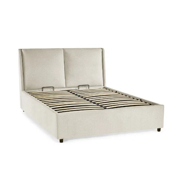 Maddock beige ottoman storage bed with split-panel headboard in a modern bedroom setting