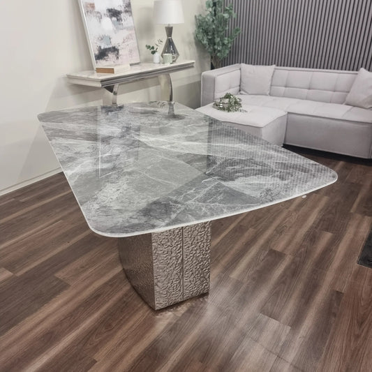 Furnish365 Roma marble dining table with hammered metal base in a contemporary dining room setting