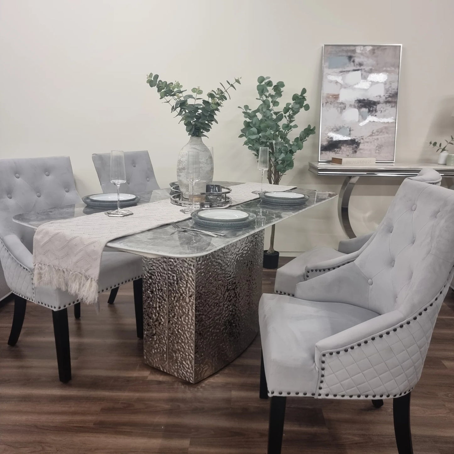 Furnish365 Roma marble dining table with hammered metal base in a contemporary dining room setting