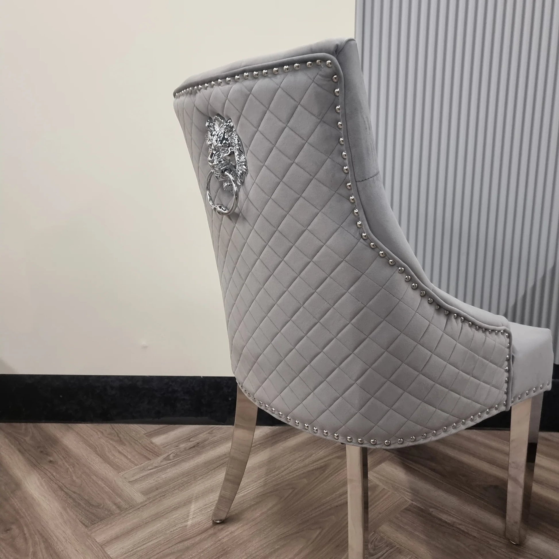 Furnish365 Bentley velvet dining chair with quilted back and chrome lion knocker in a modern dining setting