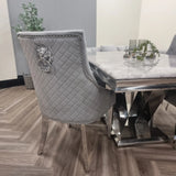 Furnish365 Bentley velvet dining chair with quilted back and chrome lion knocker in a modern dining setting