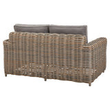 Hill Interiors Amalfi beige outdoor set in a contemporary patio with natural lighting