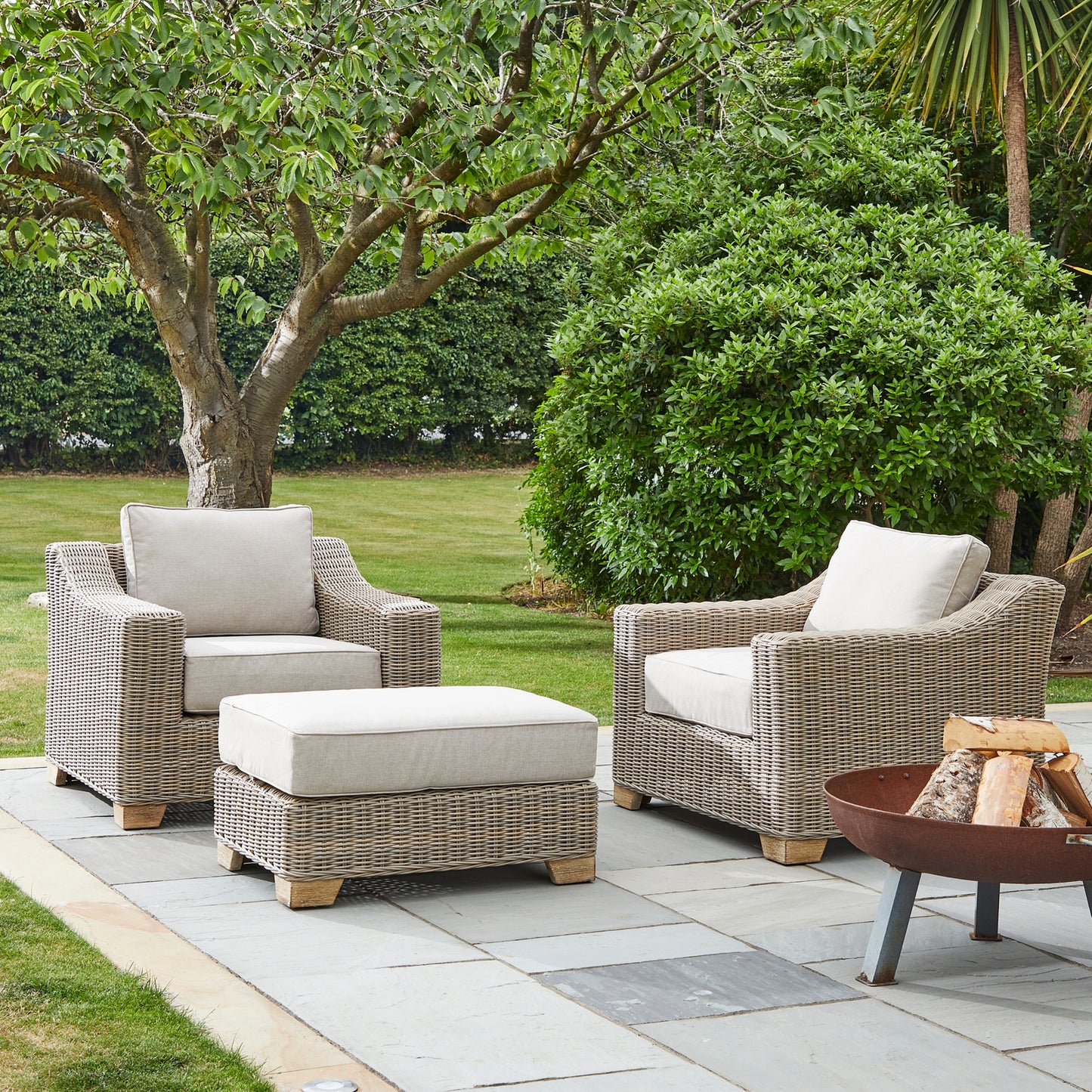 Close-up of Hill Interiors Capri outdoor foot stool showcasing the synthetic fabric texture and stitching details