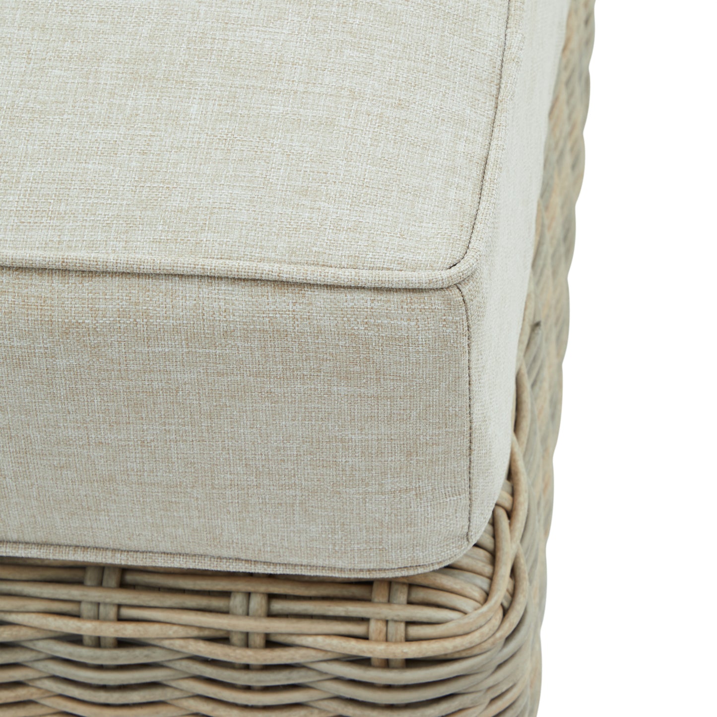 Hill Interiors Capri beige outdoor foot stool in a contemporary patio with natural lighting