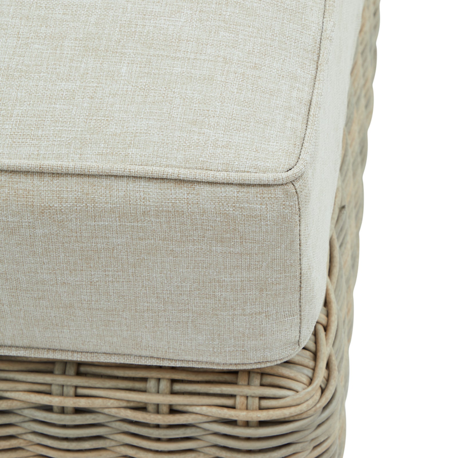 Hill Interiors Capri beige outdoor foot stool in a contemporary patio with natural lighting