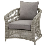 Side view of Hill Interiors Palma outdoor set showing the beige fabric and metal frame