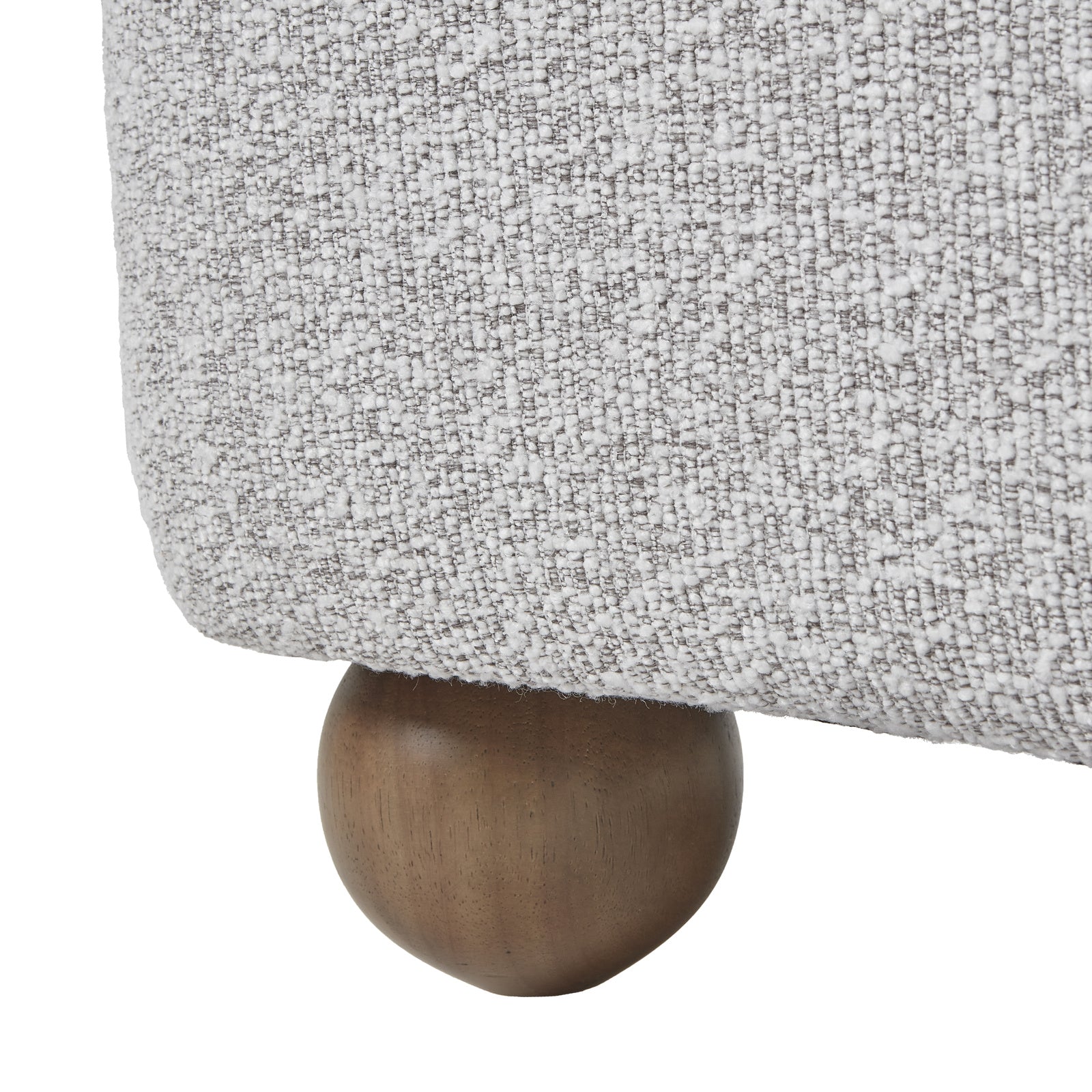 Close-up of Hill Interiors Greige Hui armchair showcasing the fabric texture and stitching details