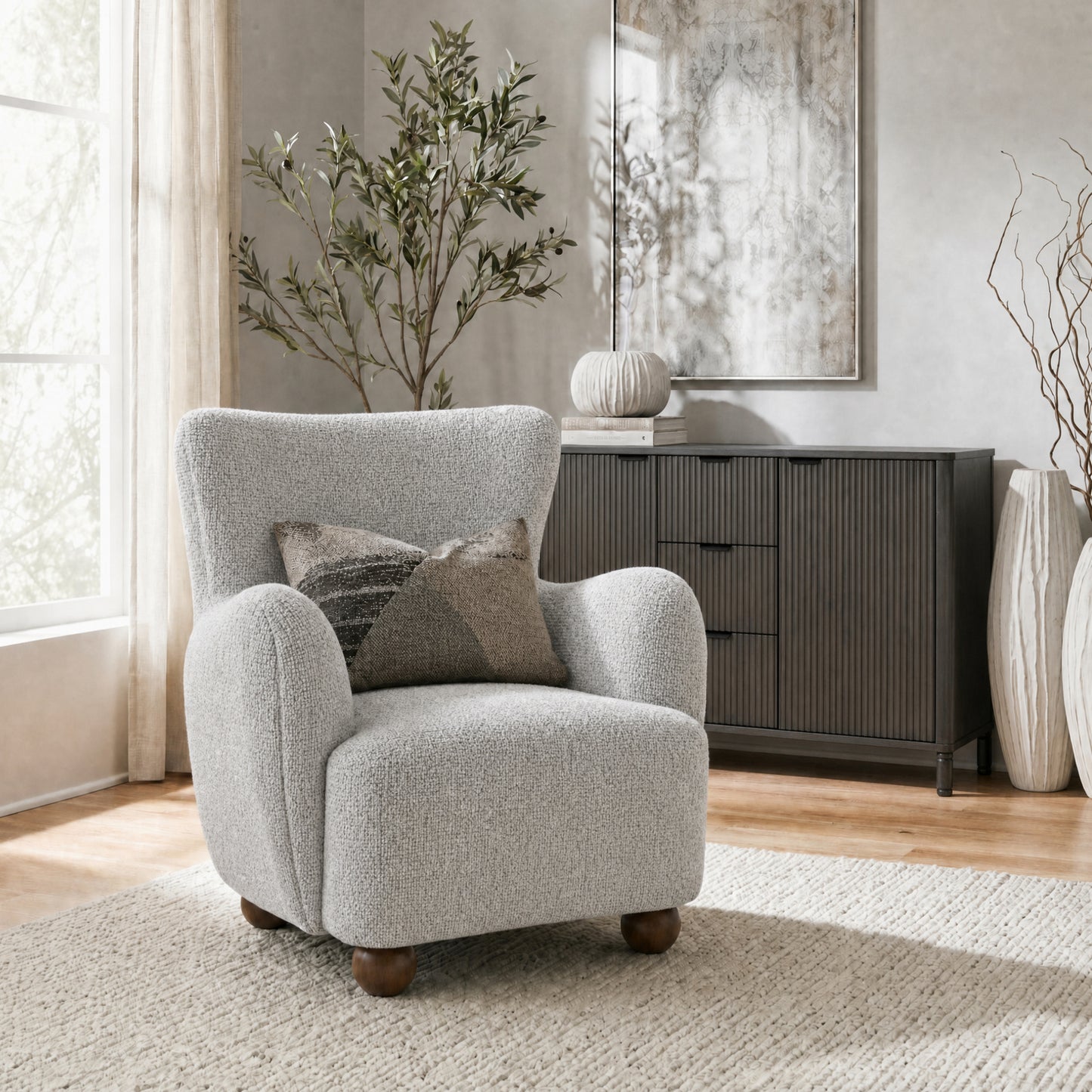 Hill Interiors Greige Hui large fabric armchair placed in a modern living room setting