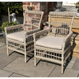 Close-up of Hill Interiors Provence outdoor dining chair showcasing the synthetic fabric texture and stitching details