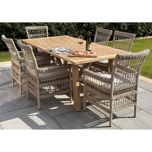 Hill Interiors Provence Collection large brown wooden outdoor dining table in a modern garden setting