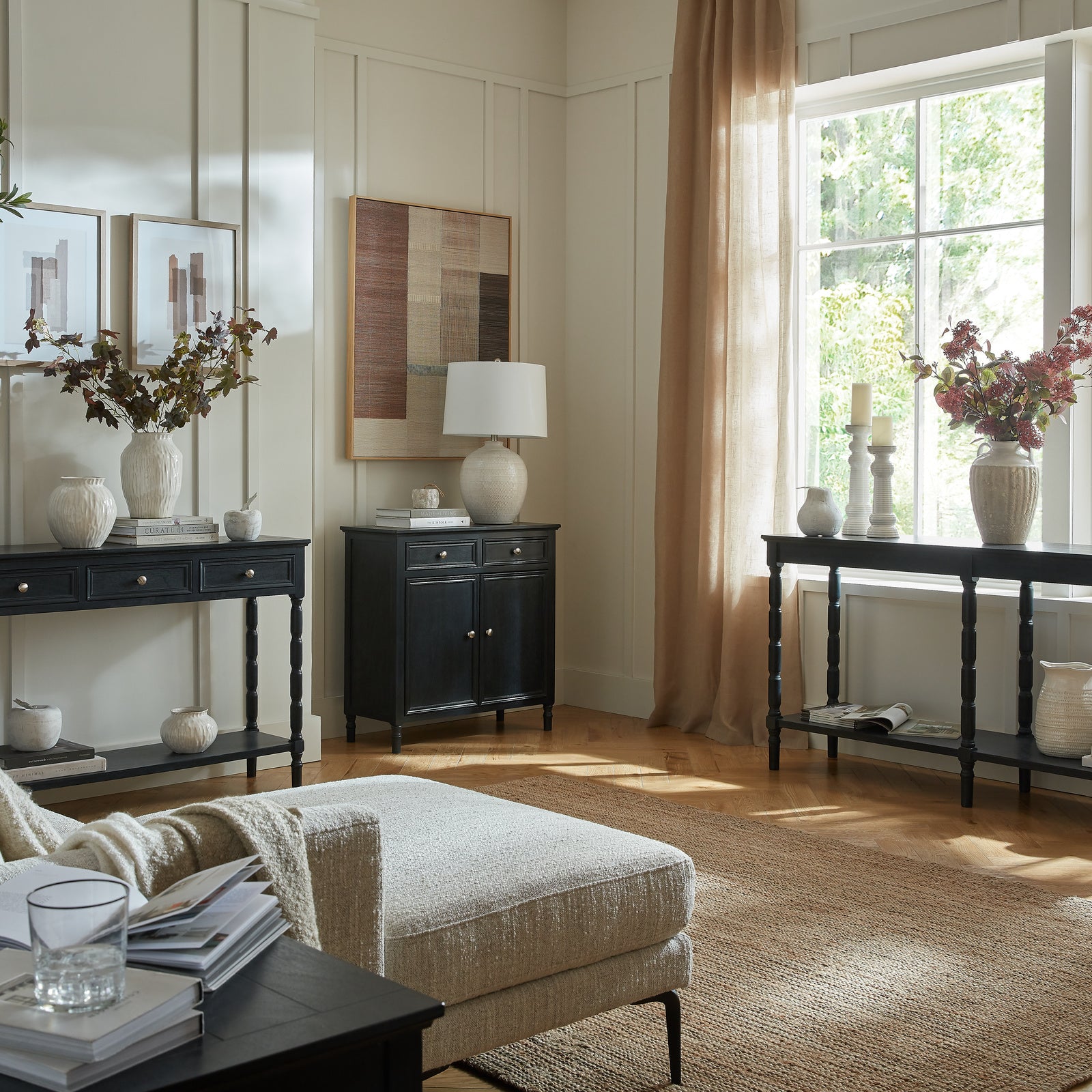 	Side view of Hill Interiors Contour Collection black wooden sideboard with 2 drawers and 2 doors