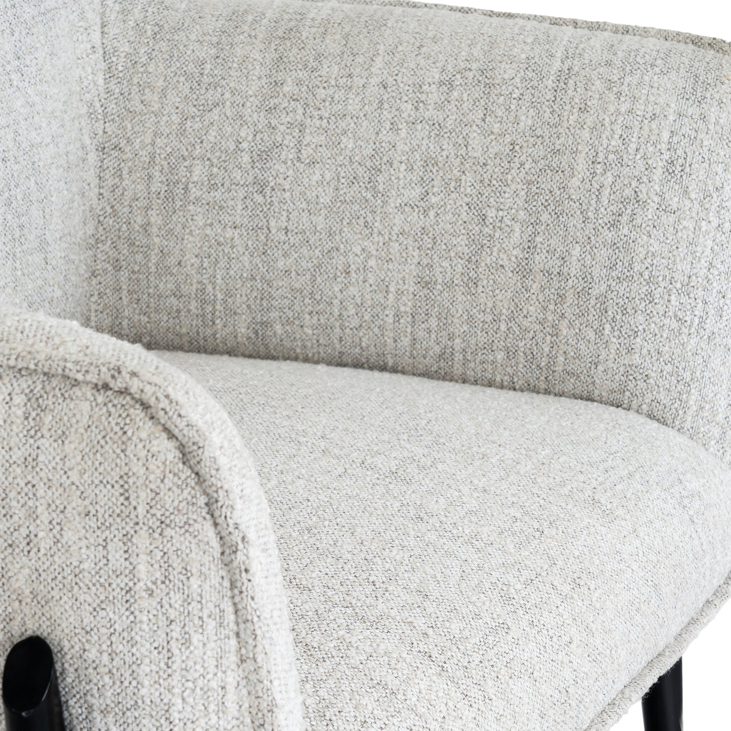 	Close-up of Hill Interiors Zephra armchair showcasing the white fabric texture and stitching details