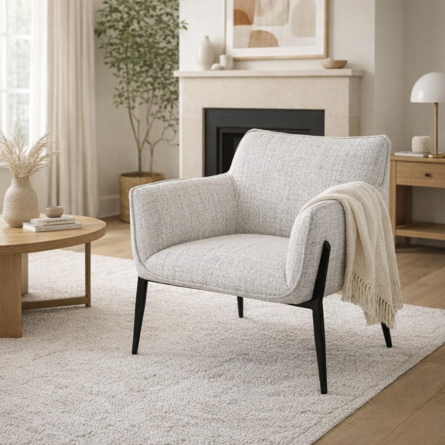 Hill Interiors Zephra white fabric armchair placed in a modern living room setting
