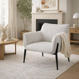 Hill Interiors Zephra white fabric armchair placed in a modern living room setting