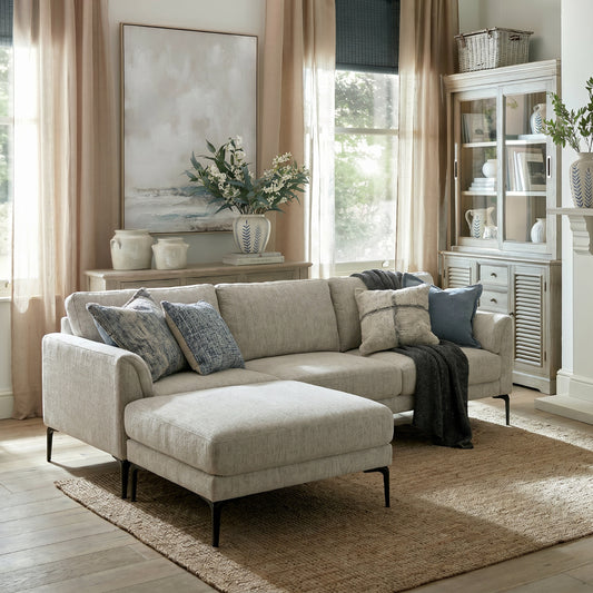 Side view of Hill Interiors Zephra white three seater sofa showing the spacious silhouette and fabric upholstery