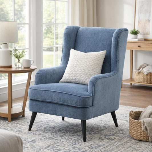 Hill Interiors Vellis blue wingback armchair in a modern living room setting
