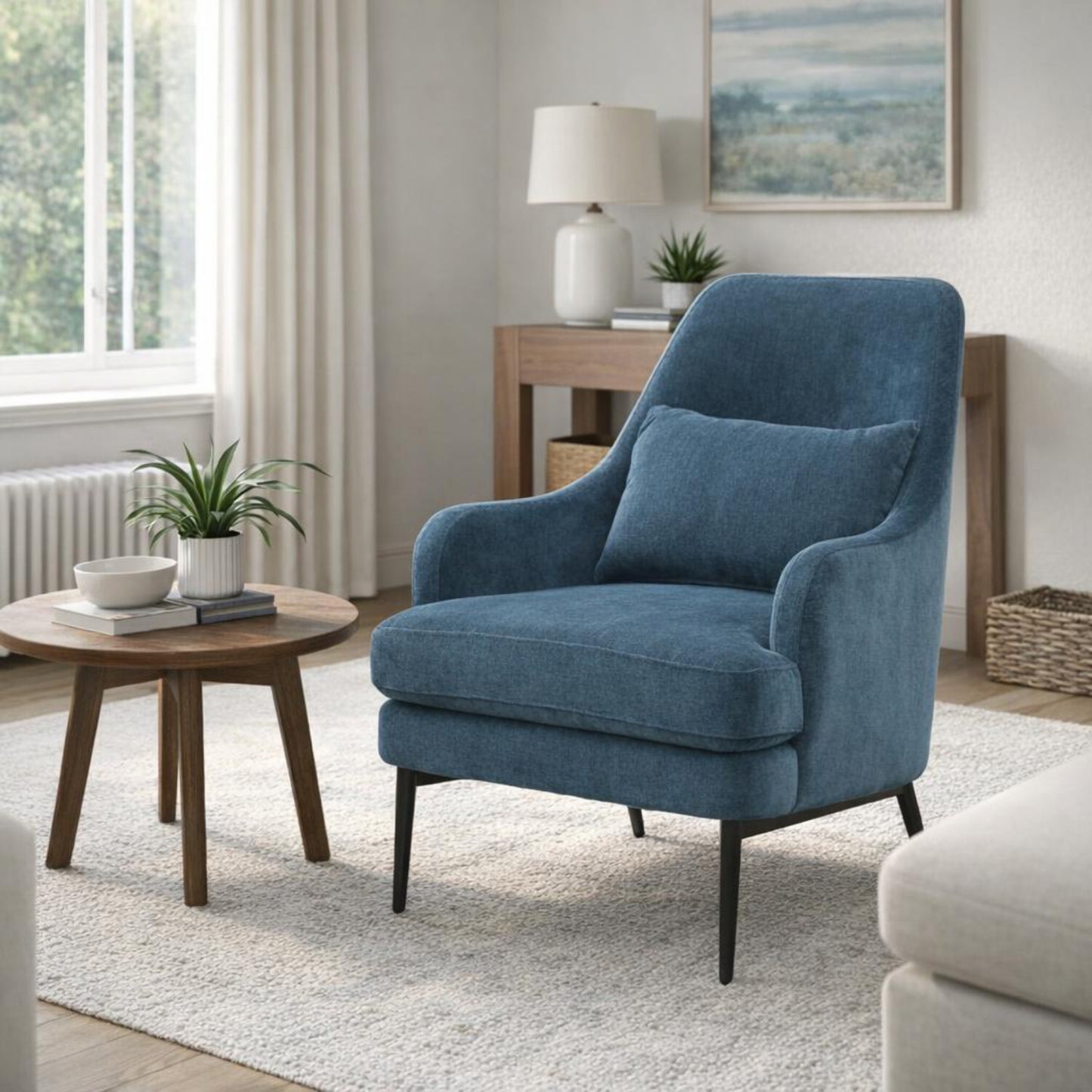 Hill Interiors Avaris blue wingback armchair in a modern living room setting