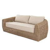 	Hill Interiors Bloom Collection brown outdoor sofa in a modern garden setting
