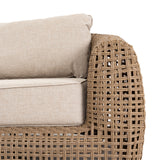	Hill Interiors Bloom Collection brown outdoor sofa in a modern garden setting