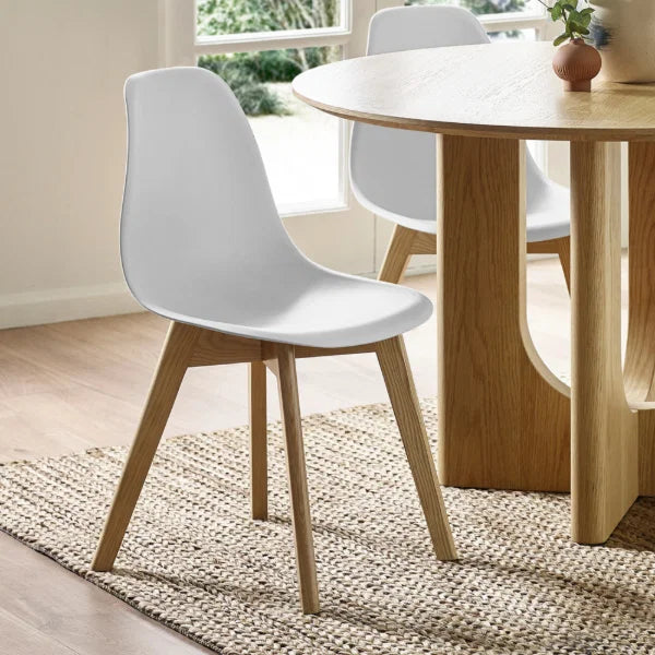 Agatha set of 2 white dining chairs in a modern dining room setting