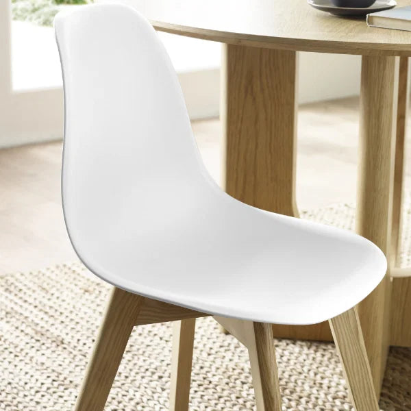 Agatha set of 2 white dining chairs in a modern dining room setting