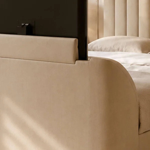 Alana cream velvet TV bed with remote-controlled lift in a modern bedroom setting