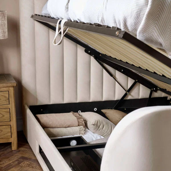 Alana cream velvet TV bed with remote-controlled lift in a modern bedroom setting