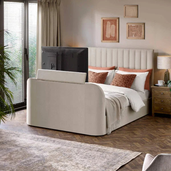 Alana cream velvet TV bed with remote-controlled lift in a modern bedroom setting