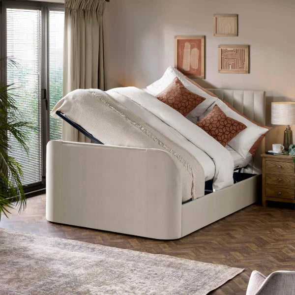 Alana cream velvet TV bed with remote-controlled lift in a modern bedroom setting
