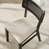 Julian Bowen Annika set of 2 satin black rattan back dining chairs with soft touch fabric seats in a modern dining setting