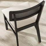 Julian Bowen Annika set of 2 satin black rattan back dining chairs with soft touch fabric seats in a modern dining setting