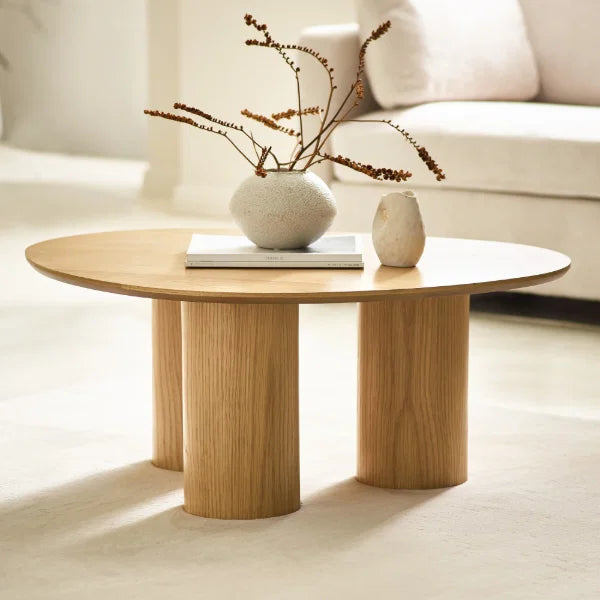 Anya oak effect asymmetrical coffee table in a modern Scandinavian living room setting