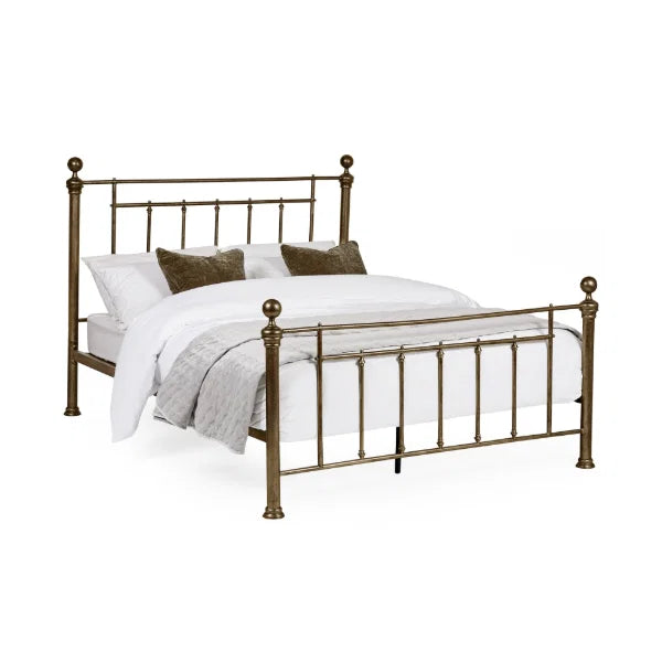 Aurelia brass effect metal bed in a modern bedroom setting