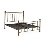 Aurelia brass effect metal bed in a modern bedroom setting