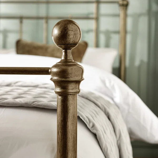 Aurelia brass effect metal bed in a modern bedroom setting