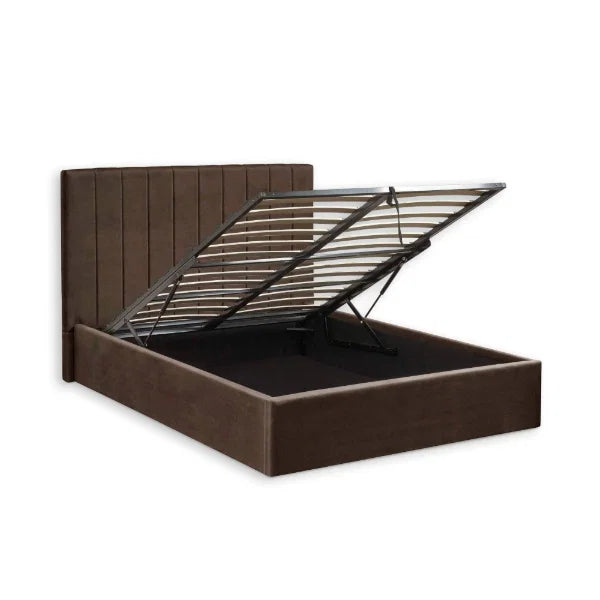 Aylen chocolate velvet ottoman storage bed with panelled headboard in a modern bedroom setting