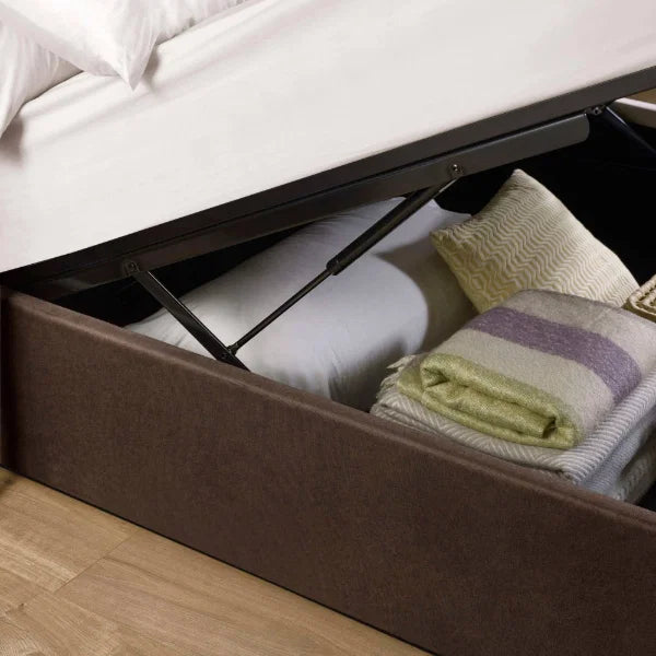 Aylen chocolate velvet ottoman storage bed with panelled headboard in a modern bedroom setting