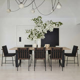 	LPD Furniture Antibes russet wood effect dining table with black U-shaped legs in a modern dining room setting