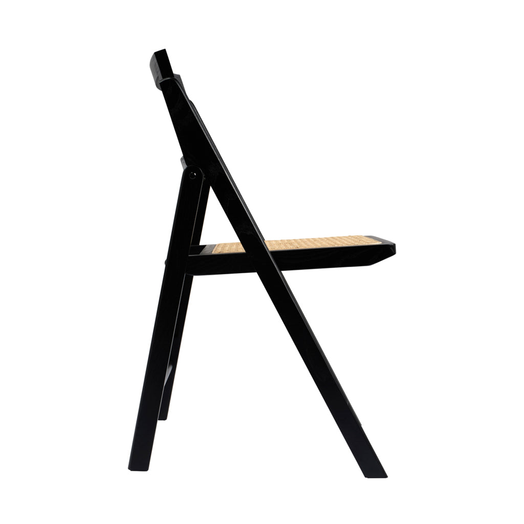 LPD Furniture Ashton black matte dining chair with rattan detailing and ash wood frame in a modern dining setting