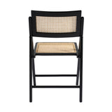 LPD Furniture Ashton black matte dining chair with rattan detailing and ash wood frame in a modern dining setting
