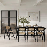 LPD Furniture Ashton black matte dining chair with rattan detailing and ash wood frame in a modern dining setting