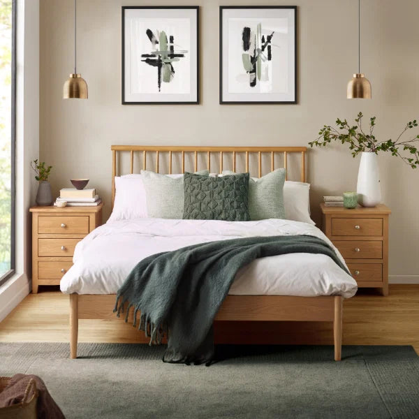 Belton natural oak spindle double bed with tapered legs in a modern bedroom setting