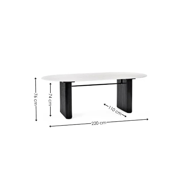 Bolivia oval marble-effect dining table with white glass top and fluted black pedestal legs in a modern dining room setting