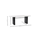Bolivia oval marble-effect dining table with white glass top and fluted black pedestal legs in a modern dining room setting
