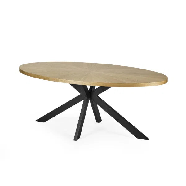 Bondi oval dining table with surfboard-shaped light oak top and black legs in a modern dining setting
