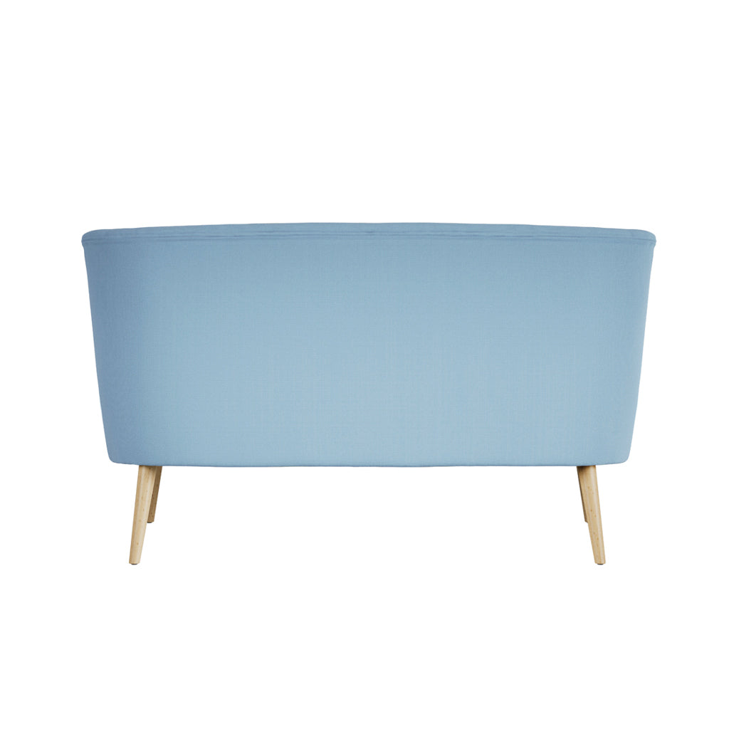 LPD Furniture Beau Cornflower Blue 2 seater sofa with tufted back and blonde wood legs in a modern living room setting