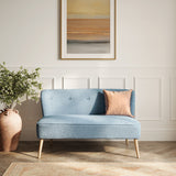 LPD Furniture Beau Cornflower Blue 2 seater sofa with tufted back and blonde wood legs in a modern living room setting